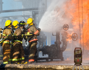 firefighters with gas detection area monitor