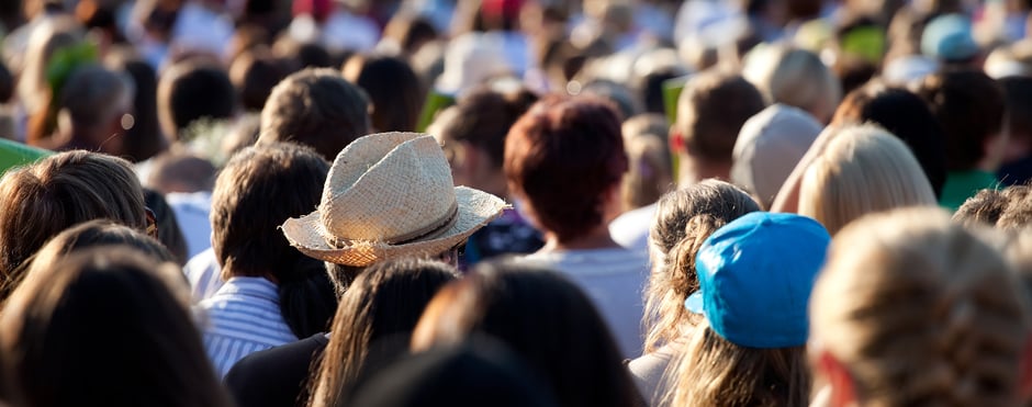A crowd of people walking safely at an event protected by gamma radiation detection
