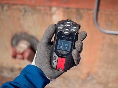 G7c-quad-in-gloved-hand-with-concrete-background-400w