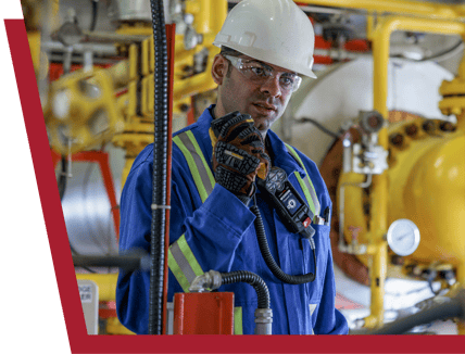 Oil and gas worker using Blackline Safety's RSM mic to communicate with their team.