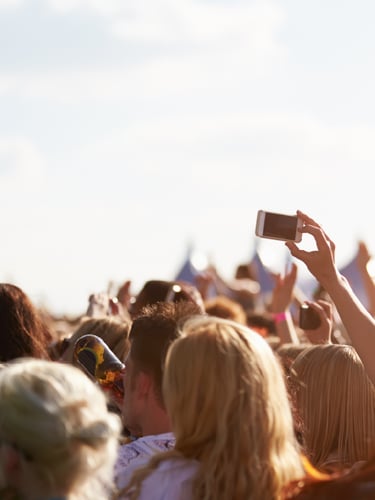 Public crowd at a show outdoors.